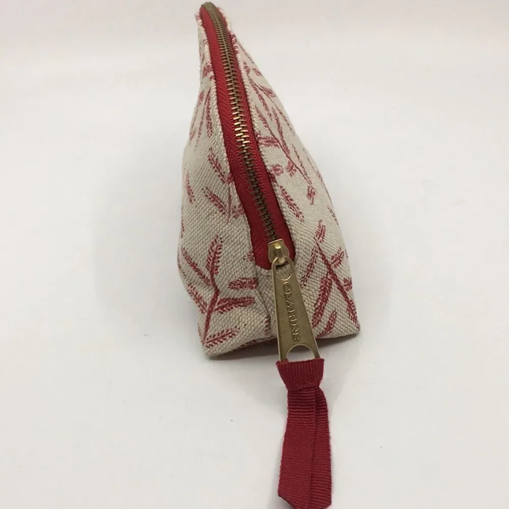 FEED 10 Clarins makeup cosmetics light tan and red carry-all pouch